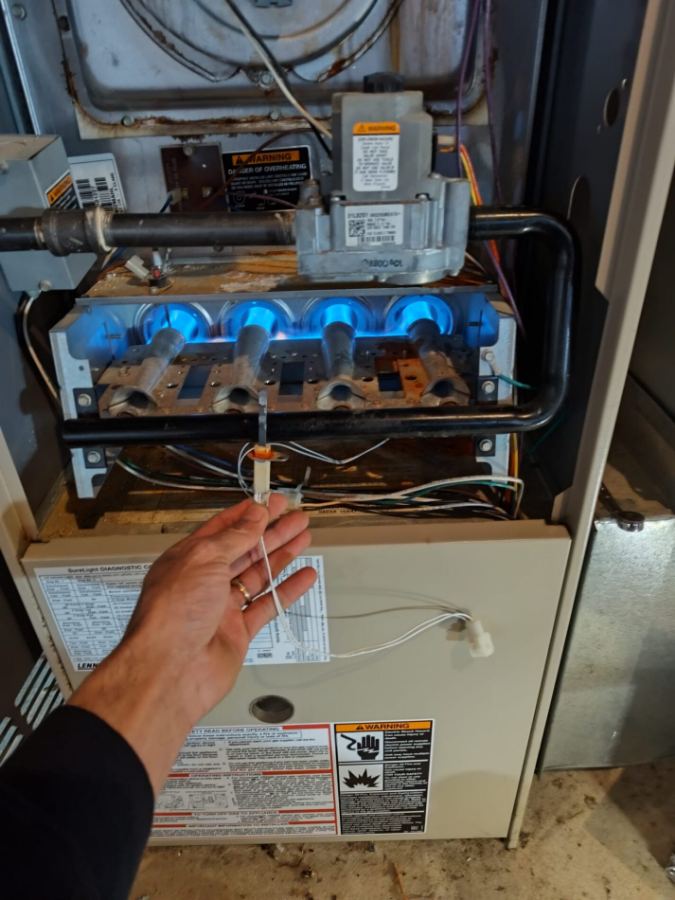 Furnace burners running with blue flames during a Cool Temp service visit