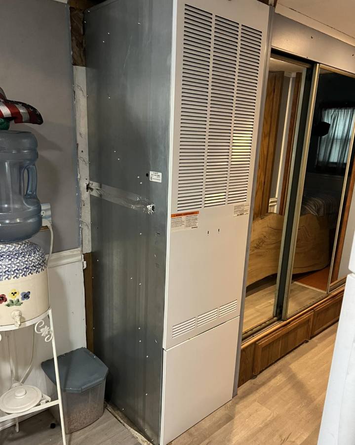Utility closet air handler before duct service